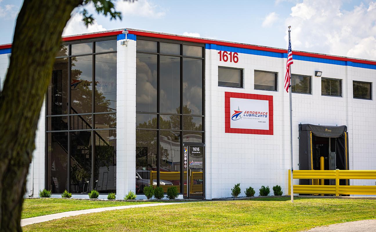 Aerospace Lubricants building with red and blue accents and text "1616".